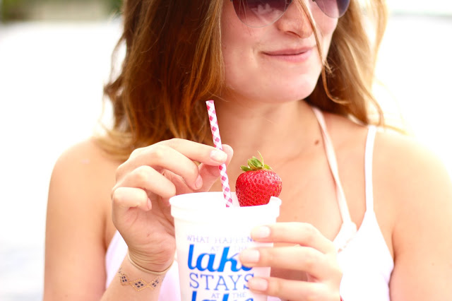 a girl with pink lemonade