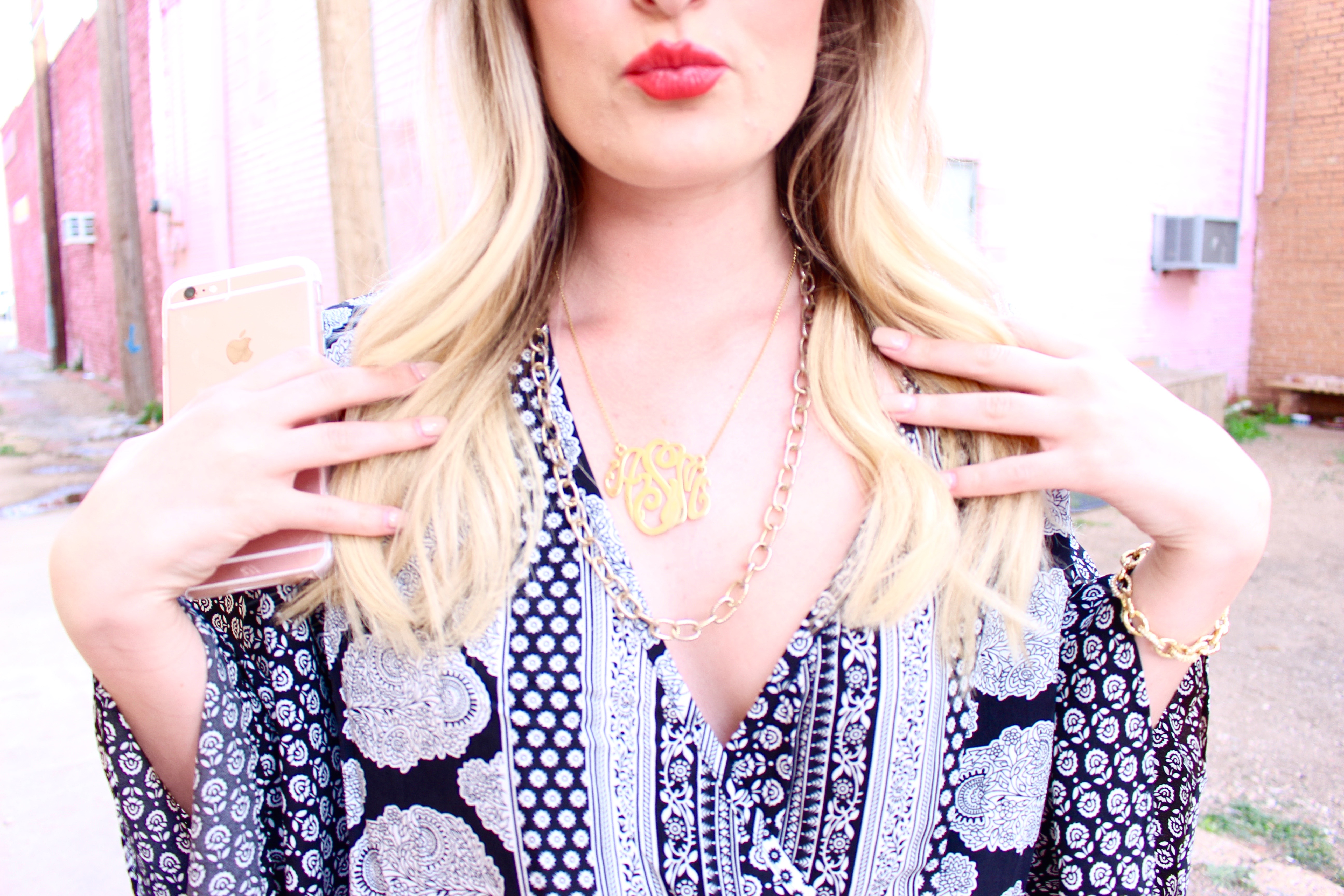 monogram necklace details on a romper