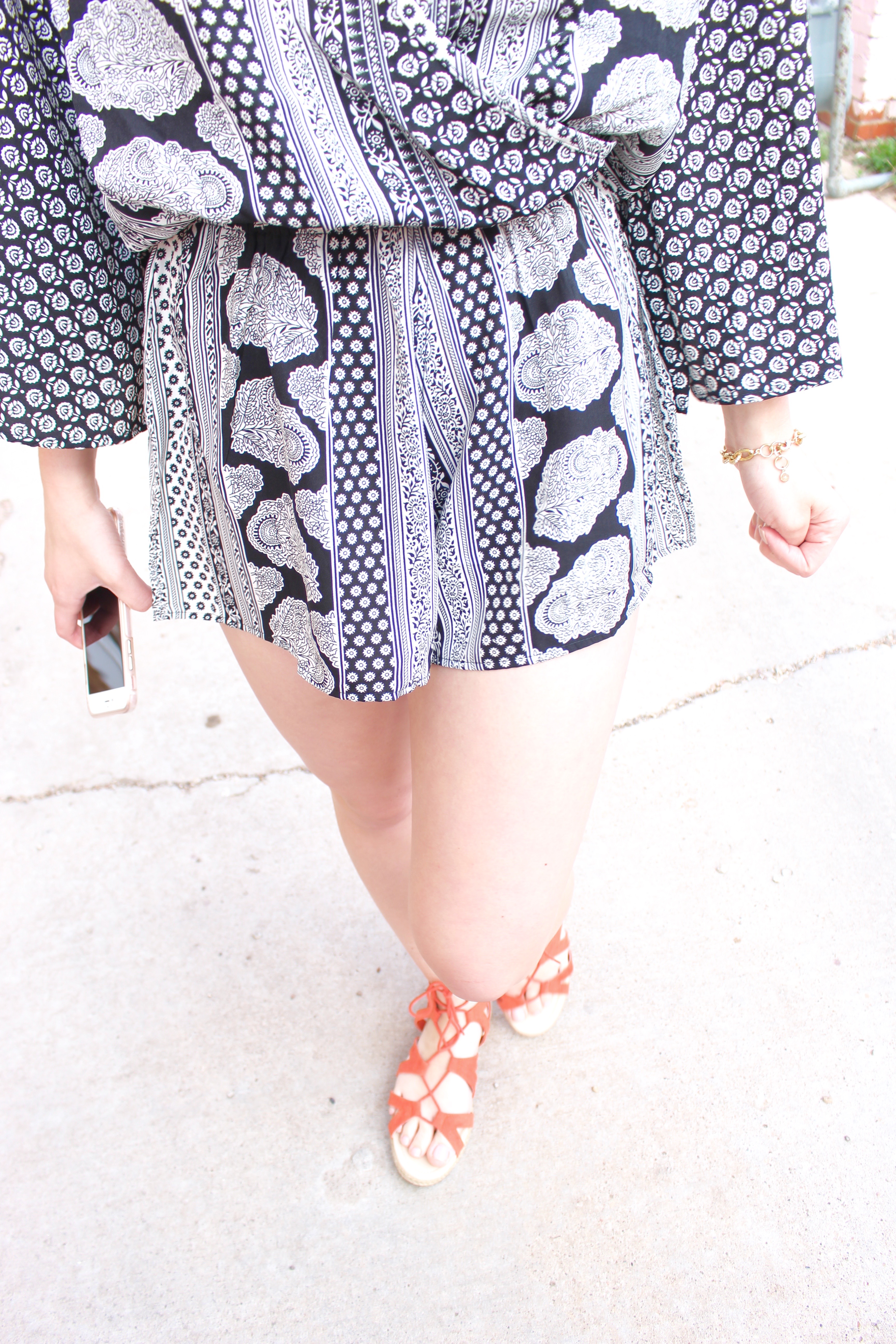 romper details with orange shoes