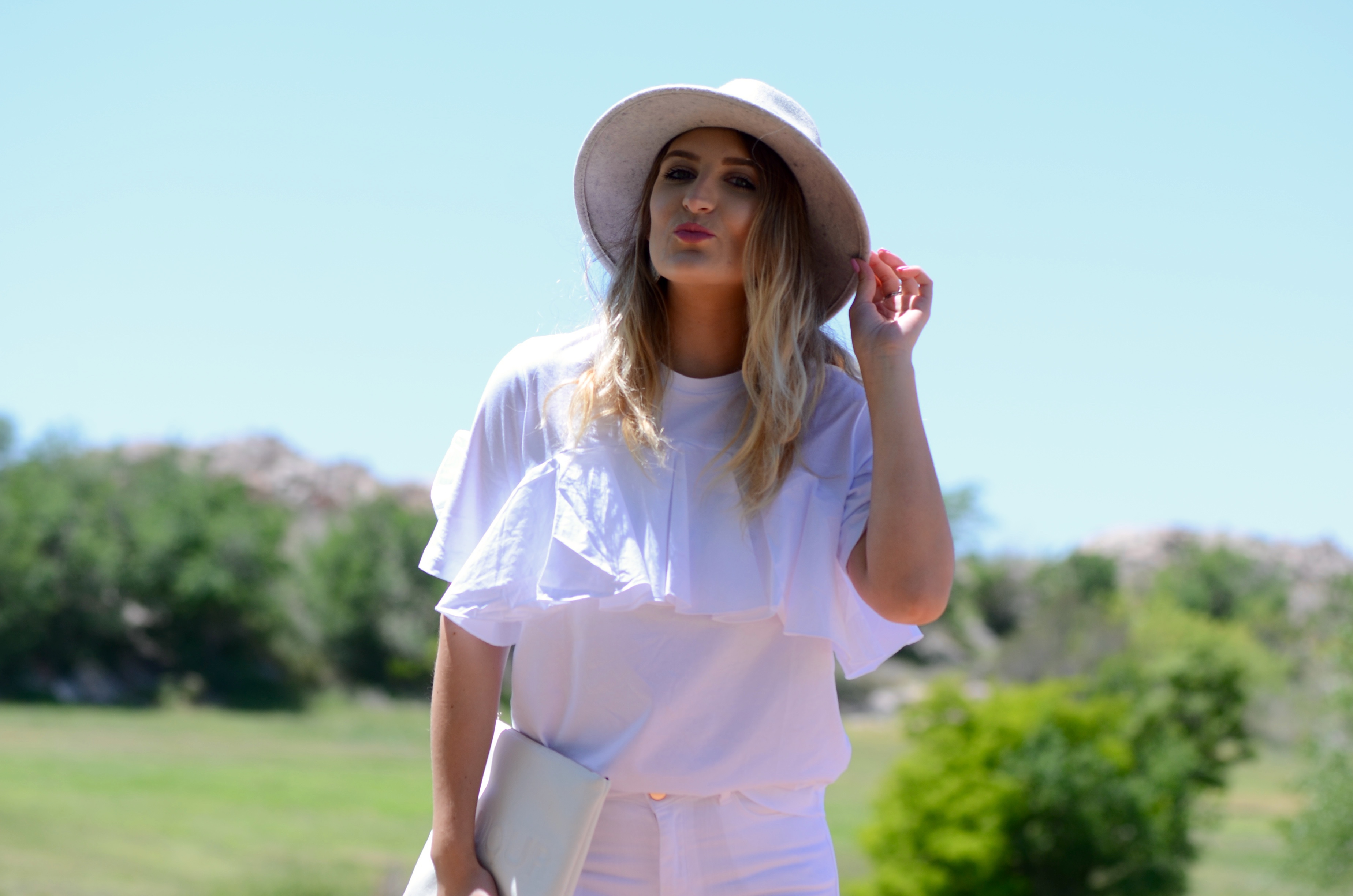 white ruffled top look