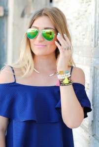 green ray bans and bracelet details