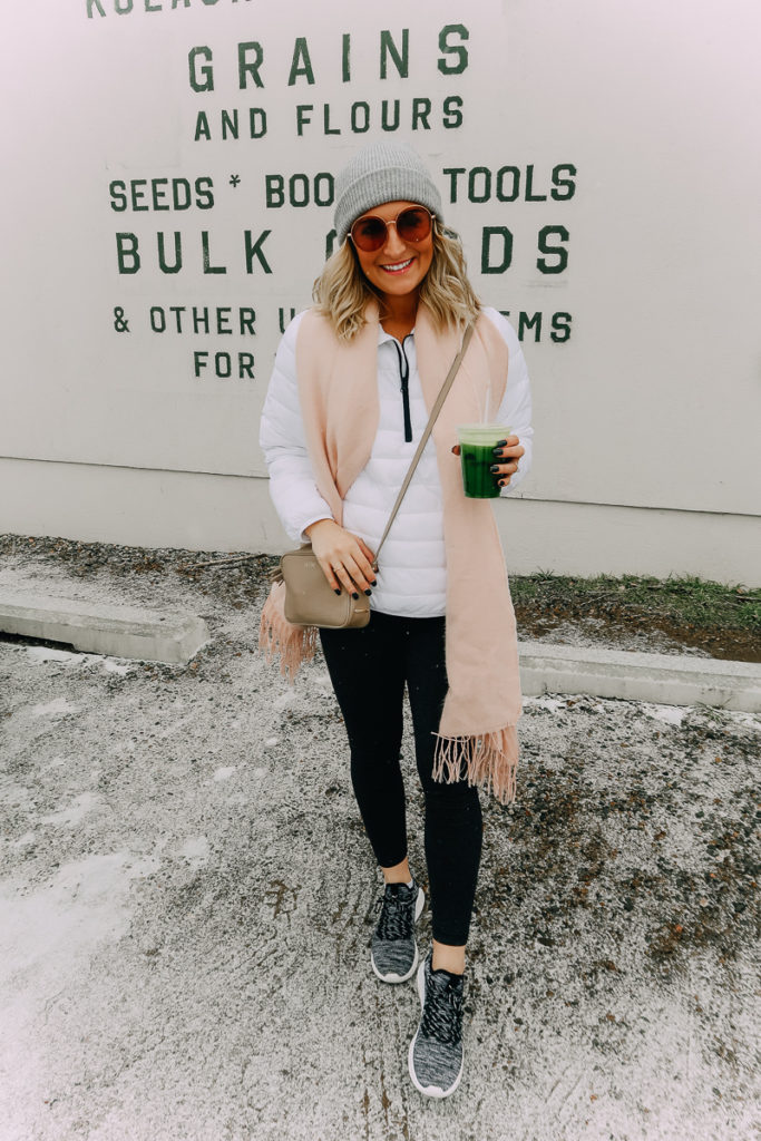 Santa Fe Weekend featured by top US travel blogger Audrey Madison Stowe; Image of woman drinking a juice.