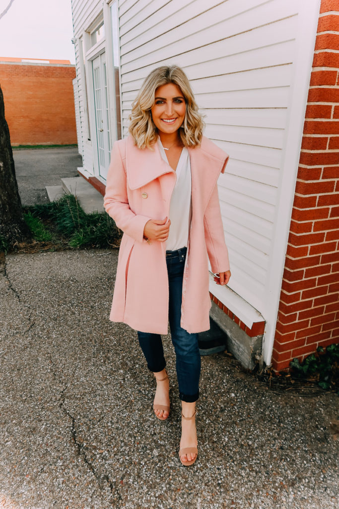 Ways To Wear a White Blouse featured by top US fashion blogger Audrey Madison Stowe; Image of woman wearing white blouse, pink coat and nude heels.